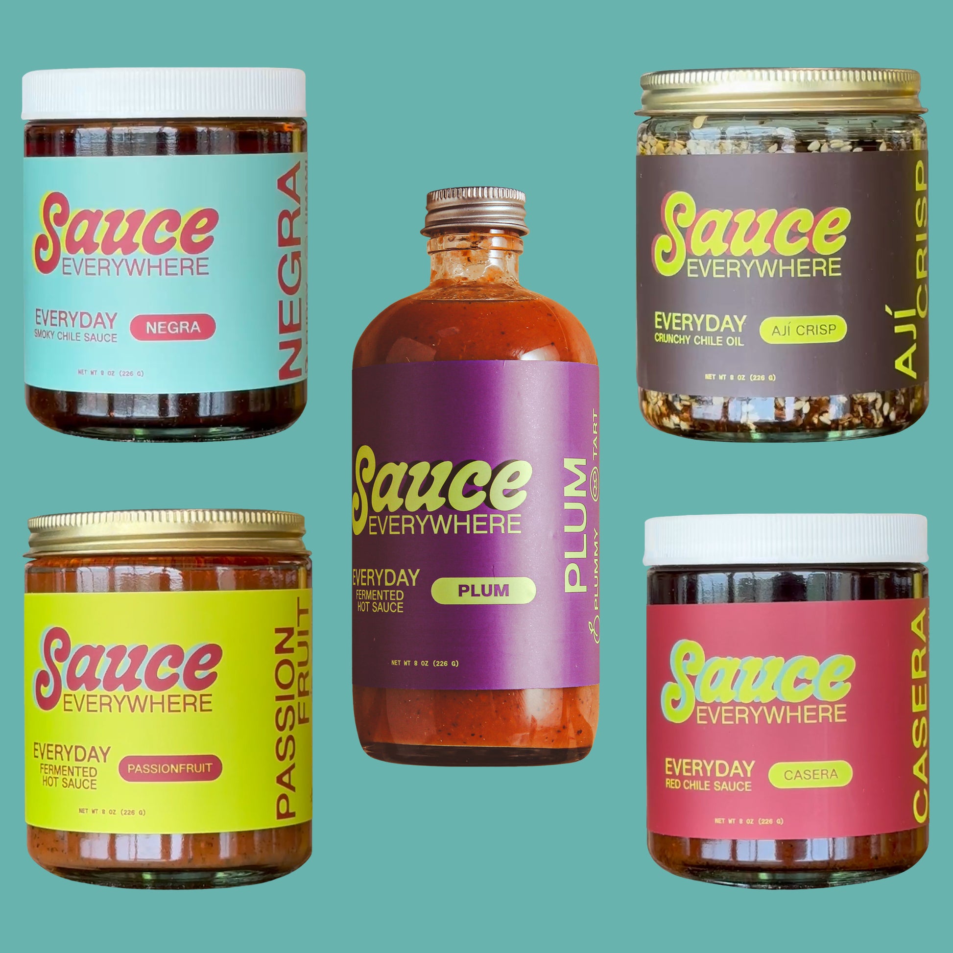 Five glass jars of chile sauces by Sauce Everywhere against cyan background.